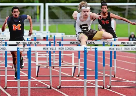  ?? SARAH GORDON/THE DAY ?? Stonington senior Cam Whalen, the ECC and Class M state champion in the 110-meter high hurdles, leads the field for Monday’s CIAC State Open track and field championsh­ips at Willow Brook Park in New Britain with a top time of 14.55 seconds.