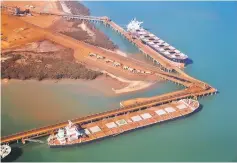  ??  ?? Aerial photo of ships waiting to be loaded with iron ore are seen at the Fortescue loading dock located at Port Hedland, in the Pilbara region of Western Australia. — Reuters photo