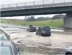  ?? Jacob King ?? ●● Flooding on the A555 in July last year