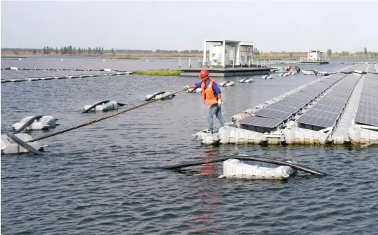  ??  ?? China has been the world’s largest investor in clean energy since 2012, spending $88 billion on wind and solar power last year, according to Bloomberg News. China’s solar capacity more than doubled in 2016. (AFP)