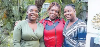  ?? ?? Proud mom Gloria Reid (centre) with her daughters Reasheal (left) and Reacheal Wallace.