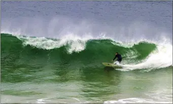  ??  ?? Sheena Hanrahan’s image of a surfer chasing a breaking wave.