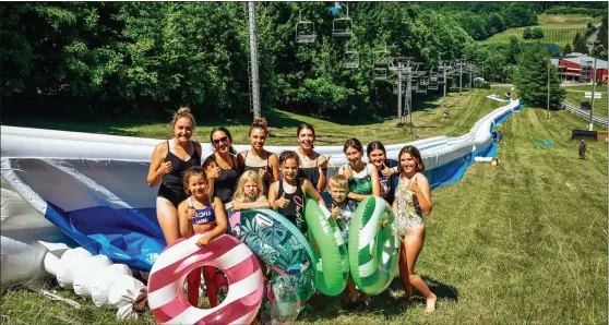  ?? SUBMITTED PHOTO - PHIL BOWMAN, BEAR CREEK RESORT ?? The world’s largest inflatable Slip ‘N Slide Tubing Course, stretching over 1.5miles on more than 20courses, opened at Bear Creek Mountain Resort in Macungie July 16. To meet high demand for afternoon sessions, operation will be from noon to 5p.m. starting Aug. 7.