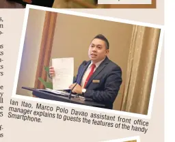  ??  ?? Ian Itao, manager Marco Polo explains Davao Smartphone. to guests assistant the features