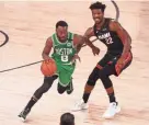  ?? KIM KLEMENT/USA TODAY SPORTS ?? Celtics guard Kemba Walker (8) drives against Heat forward Jimmy Butler (22) during the second half of Game 3 of the Eastern Conference Finals on Saturday.