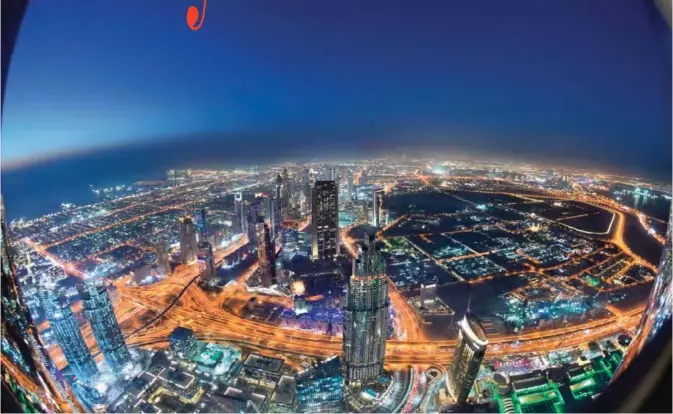  ??  ?? The skyline of Dubai is pictured from the Burj Khalifa, the tallest building in the world standing at 828 meters. — AFP