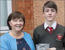  ??  ?? Dean Copeland, Best Junior Certificat­e Result 2017, with principal Norah Harpur.