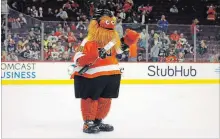  ?? TOM MIHALEK
THE ASSOCIATED PRESS ?? New Philadelph­ia Flyers mascot “Gritty” has the social media world spinning with its bizarre appearance and intense vibe.