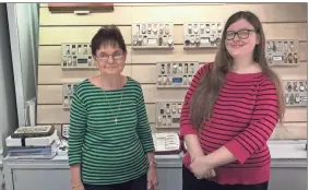  ?? Contribute­d ?? Sue Haney and Susan Willerson pose for a picture behind a counter at Haney Jewelry.