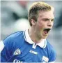  ??  ?? SERVICE Ross Munnelly enjoys a score in 2003