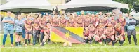  ?? ?? Sarawak players and team officials gather for a group photo at Song Kheng Hai rugby field.