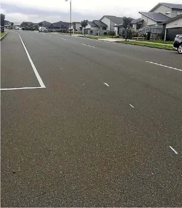  ??  ?? Dashed lines for a new cycleway appeared on Porirua’s Aotea Drive last week, much to the surprise of the people who live on the street.