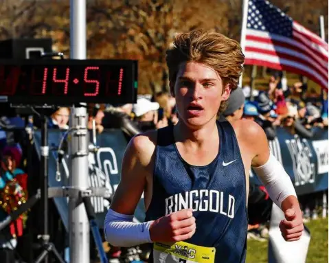  ?? JOHN TLUMACKI/GLOBE STAFF ?? Ryan Pajak of Ringgold (Pa.) won the boys’ Northeast Regional in a course-record 14:51 at Franklin Park.