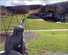  ?? LISA RATHKE - THE ASSOCIATED PRESS ?? In this Oct. 23photo, a sculpture of a skier and slopes, rear, await the ski season at Sugarbush Resort in Warren, Vt. In the tight labor market, ski areas are having a tough time hiring seasonal workers so they’re upping the ante by boosting wages, offering more worker housing and other incentives.