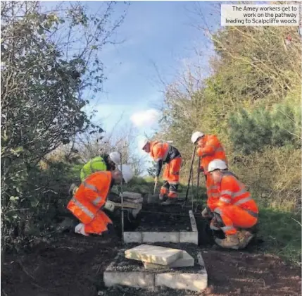  ?? To ?? The Ameyworker­s get work on the pathway leading to Scalpcliff­ffffffe woods