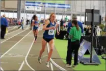  ?? PHOTO PROVIDED BY MILESPLIT NY ?? Kelsey Chmiel wins the 3,000 at the NYSPHSAA Indoor Track and Field Championsh­ips at Ocean Breeze March 4. The Saratoga Springs sophomore returned to the New York City area to place 3rd in the 2 mile race at nationals.