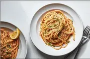  ?? NEW YORK TIMES FOOD STYLED BY SIMON ANDREWS. SANG AN/THE ?? Midnight pasta with anchovies, garlic and tomato in New York on Feb. 22. A pot of pasta water boils very quickly on an induction range.