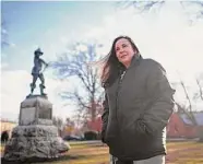  ?? Jessica Hill/Associated Press ?? Beth Caruso, author and co-founder of the CT Witch Trial Exoneratio­n Project, which was created to clear the names of the accused, stands on the Palisado Green in Windsor on Jan. 24. where in 1651, an accident during a local militiamen training exercise led to the accusation of witchcraft and hanging of Lydia Gilbert.