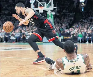  ?? ELISE AMENDOLA THE ASSOCIATED PRESS ?? Toronto Raptors guard Fred VanVleet dribbles away from Boston Celtics guard Kyrie Irving during the first quarter of Friday’s game in Boston. The Celtics beat the Raptors 123-116 in overtime.