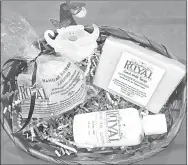  ?? COURTESY PHOTO ?? Melissa Jackson of Jacksons Royal Farm in Anderson is busy putting together made-to-order baskets, filled with a variety of products made with goat milk. Jackson is fully stocked in goat milk products, from lip balm, soap, body butter, sugar scrub,...