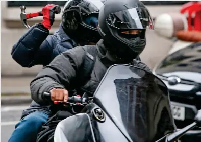  ??  ?? Crimewave: Thugs as young as 14 are using mopeds to snatch phones and throw acid