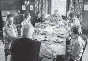  ??  ?? The Reagan family of “Blue Bloods” — clockwise from left, Will Estes, Sami Gayle, Bridget Moynahan, Tom Selleck, Amy Carlson, Donnie Wahlberg, Tony Terraciano, Andrew Terraciano and Len Cariou — used to pray at dinner. What happened?