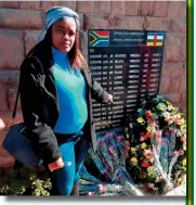  ??  ?? Kelebogile Dingoko points to her cousin’s name on the wall. Dingoko’s cousin Rifleman Karabo Matsheka was one of the 13 paratroope­rs who perished during the Battle of Bangui in the Central African Republic in 2013.