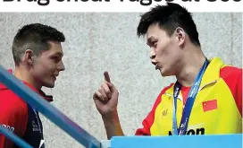  ??  ?? Bust-up: Duncan Scott (left) and Sun Yang exchange words