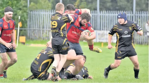  ??  ?? Llangefni (red) do battle with Bethesda in last weekend’s WRU Division One North clash at Dol Ddafydd. Picture by ALED JONES