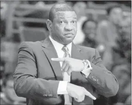  ?? DUANE BURLESON/ASSOCIATED PRESS ?? Doc Rivers is heading west after the NBA approved the Celtics trading their coach to the Los Angeles Clippers for a 2015 draft pick. The Clippers will introduce Rivers on Wednesday.
