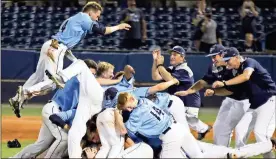  ?? / Jeremy Stewart ?? Pope’s Will Lantis (4) leaps on top of the pile as the Greyhounds celebrate following their win over Allatoona in Game 3 of the Class 6A state championsh­ip series at State Mutual Stadium. Pope won 10-2 to clinch their second straight state title.