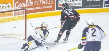  ?? JULIE JOCSAK/STANDARD STAFF ?? Goalie Christian Propp of the Barrie Colts defends the net against Oliver Castlemann of the Niagara IceDogds in OHL action at the Meridian Centre in downtown St. Catharines Friday.