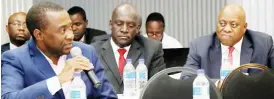  ??  ?? Mr Morris Mpala, who was the moderator, stresses a point during the Pre-Budget dialogue in Bulawayo yesterday. Among the guests are the Zimpapers Digital and Publishing general manager, Mr Marks Shayamano and Zimpapers board chairman Mr Delma Lupepe...