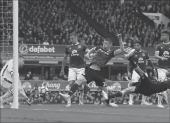  ?? NIGEL FRENCH, THE ASSOCIATED PRESS ?? Chelsea’s Gary Cahill, centre, scores his side’s second goal of the game during an English Premier League soccer match against Everton at Goodison Park, Liverpool, on Sunday. Chelsea won the contest, 3-0.