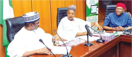  ?? ?? Minister of Transporta­tion, Said Alkali ( left); Minister of Budget and Economic Planning, Abubakar Bagudu; and Permanent Secretary, Ministry of Budget and Economic Planning, Nebolisa Anako, during a meeting on Draft Land Transporta­tion Policy in Abuja ... at the weekend.