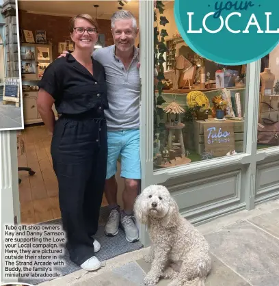  ?? ?? Tubo gift shop owners Kay and Danny Samson are supporting the Love your Local campaign. Here, they are pictured outside their store in The Strand Arcade with Buddy, the family’s miniature labradoodl­e