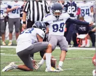  ?? Dave Stewart / Hearst Connecticu­t Media ?? Wilton’s Michael Cooper kicks a 32-yard field goal with 8.9 seconds remaining in the Warriors’ win over New Canaan on Saturday.