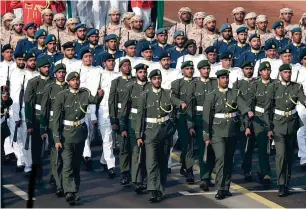  ?? PTI ?? EMIRATI PRESENCE: The UAE contingent marches past during the full dress rehearsal for the Republic Day parade at Rajpath in New Delhi, ahead of the event on Thursday. —