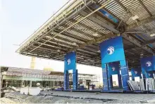  ?? Virendra Saklani/Gulf News ?? Work in progress at Adnoc’s first petrol station in Dubai on Mohammad Bin Zayed Road in Muhaisnah.