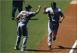  ?? DENIS POROY — GETTY IMAGES ?? The Giants’ Darin Ruf is congratula­ted by Ron Wotus after hitting a two-run home run during the second inning against the Padres on Wednesday in San Diego.