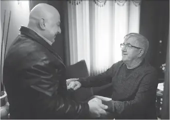  ?? DAX MELMER ?? Vets cab driver Doumit Nassar, left, meets Dan Chemello for the first time since Chemello suffered a stroke on his way home on Dec. 27. Nassar will be recognized by the Rotary Club of Windsor Roseland on Jan. 29.