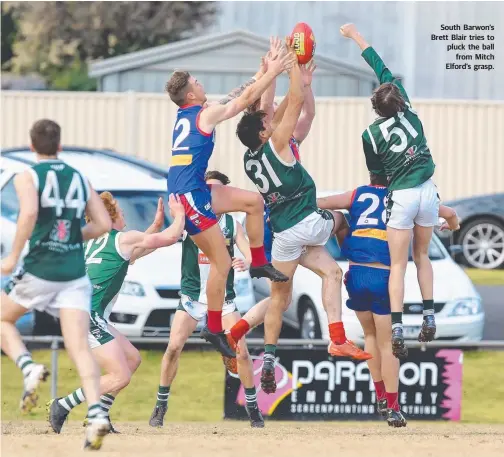  ??  ?? South Barwon’s Brett Blair tries to pluck the ball from Mitch Elford’s grasp. LAST week, Colac coach Kane Leersen put it on his troops to perform against a finals-calibre side and pick up a scalp — and a win against Leopold was a perfect way to do so....