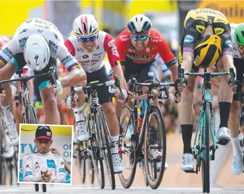  ?? Pictures: GETTY IMAGES, AFP ?? TIGHT FINISH: Caleb Ewan (second from left) finished behind Mike Teunissen (right) and Peter Sagan (left) in the first stage of the Tour de France. Inset: Ewan dons his best young rider’s white jersey on the podium.