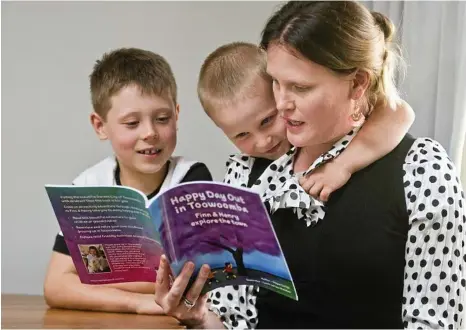  ?? PHOTO: NEV MADSEN ?? HAPPY READ: Enjoying mum Megan Carige’s new book are Finn (left) and Henry.