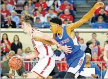  ??  ?? Kingston's Jacob Germany (24) drives past Millwood's Justin Wilson (31) in Saturday's late Class 3A state championsh­ip game at State Fair Arena.