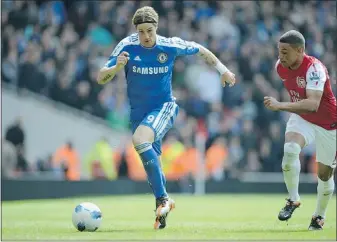  ?? — GETTY FILES ?? Chelsea forward Fernando Torres (left), pictured here in Premier League action against Arsenal, faces his former club Liverpool in the FA Cup final Saturday.