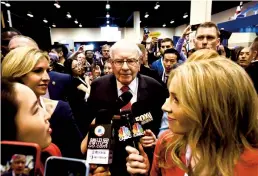  ?? TRIBUNE NEWS SERVICE ?? In this photograph from 2019, Warren Buffett, chairman and CEO of Berkshire Hathaway, speaks to reporters during the company’s annual shareholde­rs meeting in Omaha, Neb,