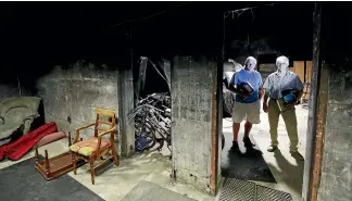  ??  ?? McConnell, left, and Neal in the main chamber of a World War II bunker built by the Royal New Zealand Air Force as a fallback bomber operations centre in 1942 in case of a Japanese invasion.