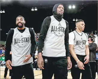  ?? Nathaniel S. Butler NBAE/Getty Images ?? KYRIE IRVING, left, and Kevin Durant, center, are teaming up in Brooklyn, while Russell Westbrook, right, has a new superstar teammate in James Harden after being traded to Houston.