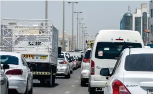  ?? SHIHAB / KHALEEJ TIMES ?? A long queue of vehicles in a Sharjah industrial area on Thursday. Roads which had been completely waterlogge­d following last week’s downpour have now been cleared.